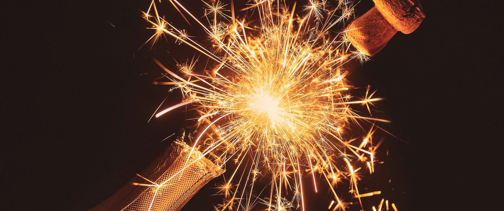 a bottle of champagne with sparklers at The Hudson